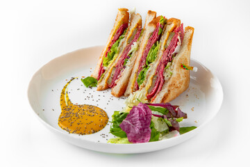 Ham sandwich. Balanced, nutritious, tasty and nutritious food. Ready-made menu for a restaurant or for delivery. Dish in a white plate isolated on a white background.