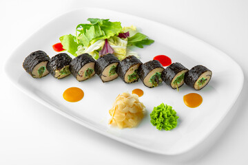 Rolls with fish paste and chuka. Balanced, nutritious, tasty and nutritious food. Ready-made menu for a restaurant or for delivery. Dish in a white plate isolated on a white background.