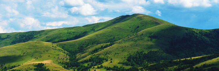 Fototapeta na wymiar Green Zlatibor mountain hill landscape with beautiful clouds in background