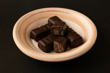 Chocolate candies on a plate.