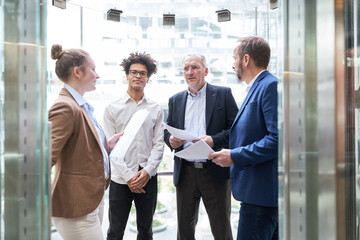 Start-up team people and consulting consultants at the window