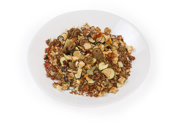 Mixture of different spices and dried vegetables on white dish