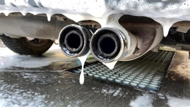 car wash.exhaust pipe in foam