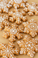 New Year's traditional gingerbread cookies decorated with sugar white icing close-up