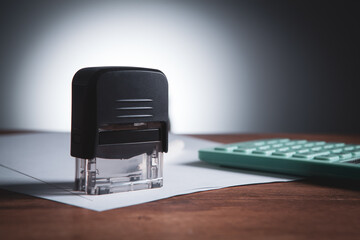 put a stamp on business contract in office