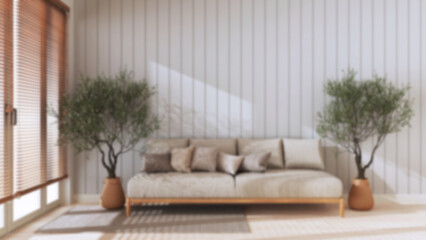 Blurred background, japandi living room with copy space. Fabric sofa with pillows, potted olive trees. Farmhouse interior design