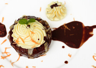 Carrot chocolate cake on plate and black background