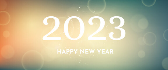 Happy new year 2023 incription on blurred background