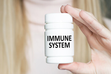 Immune System inscription on a jar in the hands of a doctor, a medical concept