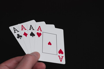 Playing cards aces on black