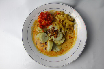 Lontong sayur or vegetable rice cake is an Indonesian traditional rice dish made of pieces of...