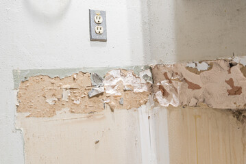 Bathroom renovation at corner with damaged drywall and indoor electrical outlet of residential house in Texas, America