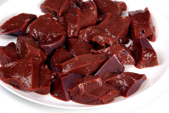 Sliced raw  liver on a white plate