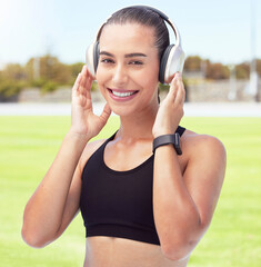 Exercise, podcast and radio with woman listen to music while exercising at a park, happy and relax....
