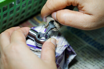 Fototapeta premium Asian workers chamfering the workpiece,production process concept
