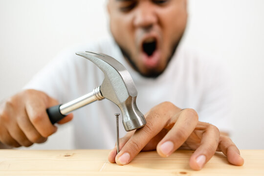 The carpenter was injured by hammer and nails. He misused the hammer and stuck it in his hand. Accidents during work require accident insurance.