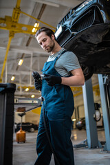 Car mechanic working in the auto repair shop