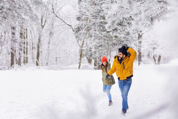 Couple running in the snow