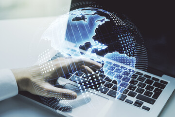 Digital America map and hands typing on laptop on background, international trading concept. Multiexposure