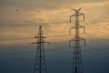 High Voltage Electric Pylons on the sunset light And Electrical Wire. Electricity Poles. Power And...