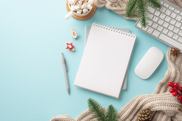 Top view photo of keyboard computer mouse notepad pen cup of hot drinking with marshmallow knitted blanket spruce branches pine cone mistletoe clips on isolated light blue background with empty space