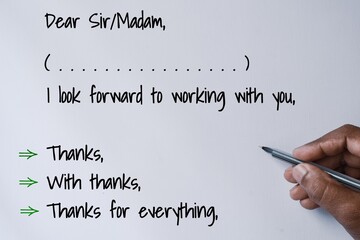 A person's decision making moment of ending letter with thank you on white background.