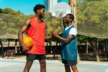 One vs one basketball game training at the court. Cinematic look image of friends practicing shots...
