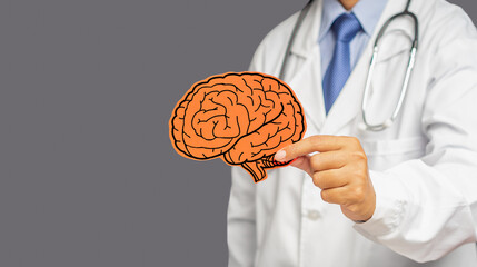 Doctor in uniform holding a red brain symbol while standing on a gray background