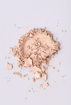 Scattered Skin Colored Powder On A Light Grey Background