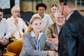 Cinematic image of a conference meeting. Business people sitting in a room listening to the...
