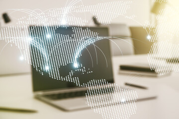 Double exposure of abstract digital world map with connections on laptop background, research and strategy concept