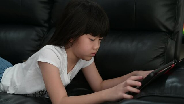 kid watching tablet, child addicted cartoon
