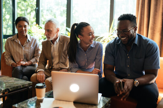cinematic image of people working in a start up business. Multiethnic team of experts working together to develop the new projects