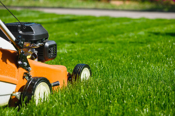 Lawn mover close up at fresh grass