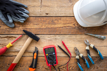 Flat lay composition with electrician's tools and accessories.