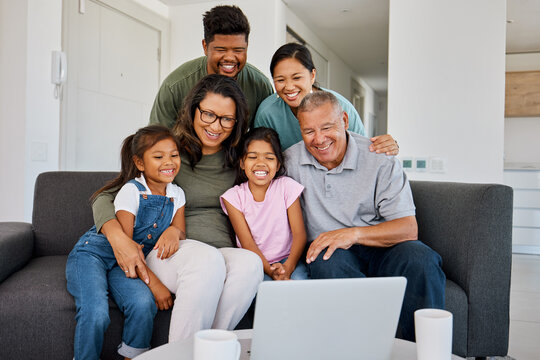 Love, smile and relax happy family with laptop streaming internet, web or funny online social media video. Big family watch subscription movie, bond or enjoy quality time together on living room sofa