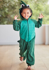 Creative, child and halloween costume by girl running in a crocodile suit, playing and laughing at...