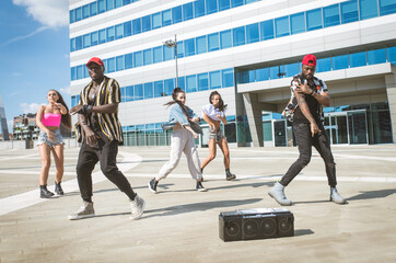 Group of hip hop dancers permorming their dance. - obrazy, fototapety, plakaty