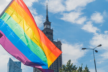 Warsaw, Poland. 25 June 2022. Warsaw's Equality Parade. LGBTQ symbolic flag with The Palace of...