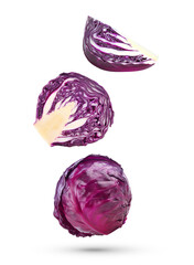 Fototapeta premium Whole and slices red cabbage falling in the air isolated on white background