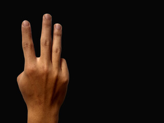 Hand gesture on black background