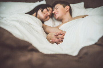 Lovely moments in bed for young couple