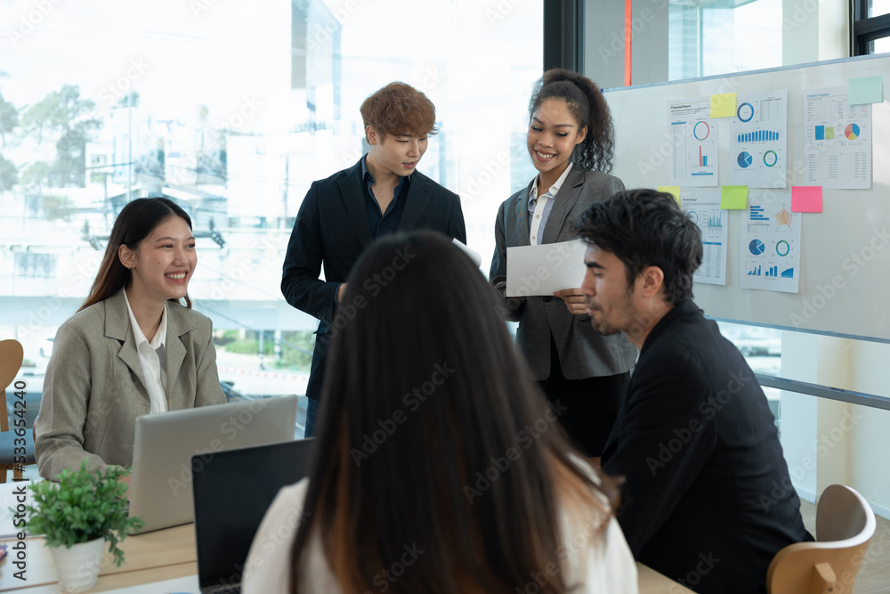 Poster group of diverse colleagues discussing for financial report with presentation on flipchart during a 