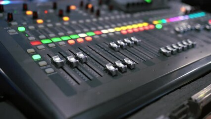Professional audio mixing console. ​Mixer. Pro audio mixing board faders and knobs. Static shot of multi-track music recording equipment faders and sliders. 