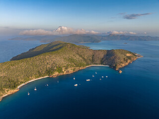 Fototapeta na wymiar Evening aerial drone view of Hayman Island, the most northerly of the Whitsunday Islands in Queensland, Australia, near the Great Barrier Reef. Blue Pearl Bay in foreground, Hook Island in the back.