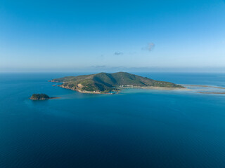 Stunning aerial drone view of Hayman Island, the most northerly of the Whitsunday Islands in Queensland, Australia, near the Great Barrier Reef. Popular tourist destination with a resort hotel.