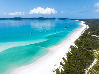 Beautiful high angle aerial drone view of famous Whitehaven Beach, part of the Whitsunday Islands National Park near the Great Barrier Reef, Queensland, Australia. Popular tourist destination.