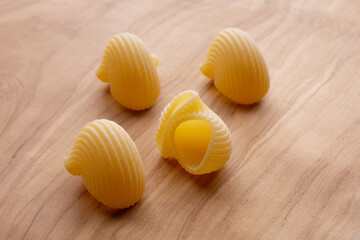 short pasta compositions on wooden background