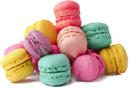 Pile of colorful macaroons isolated on white background, close up