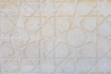Arabic texture on the wall of the mosque with stars and geometric pattern. Background or backdrop